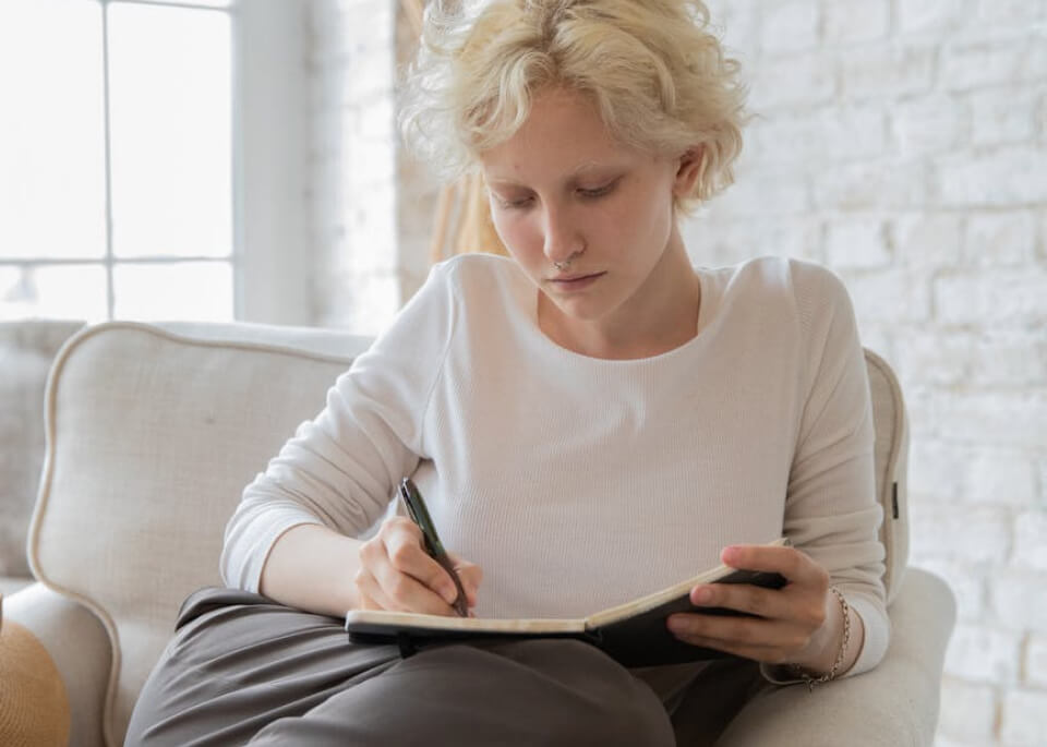 Woman writing.